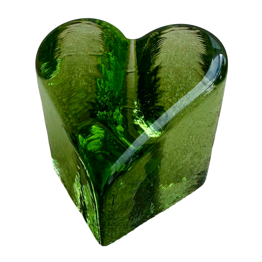 Fire & Light green glass heart paperweight, angled view showing rounded edges and rippled sides.
