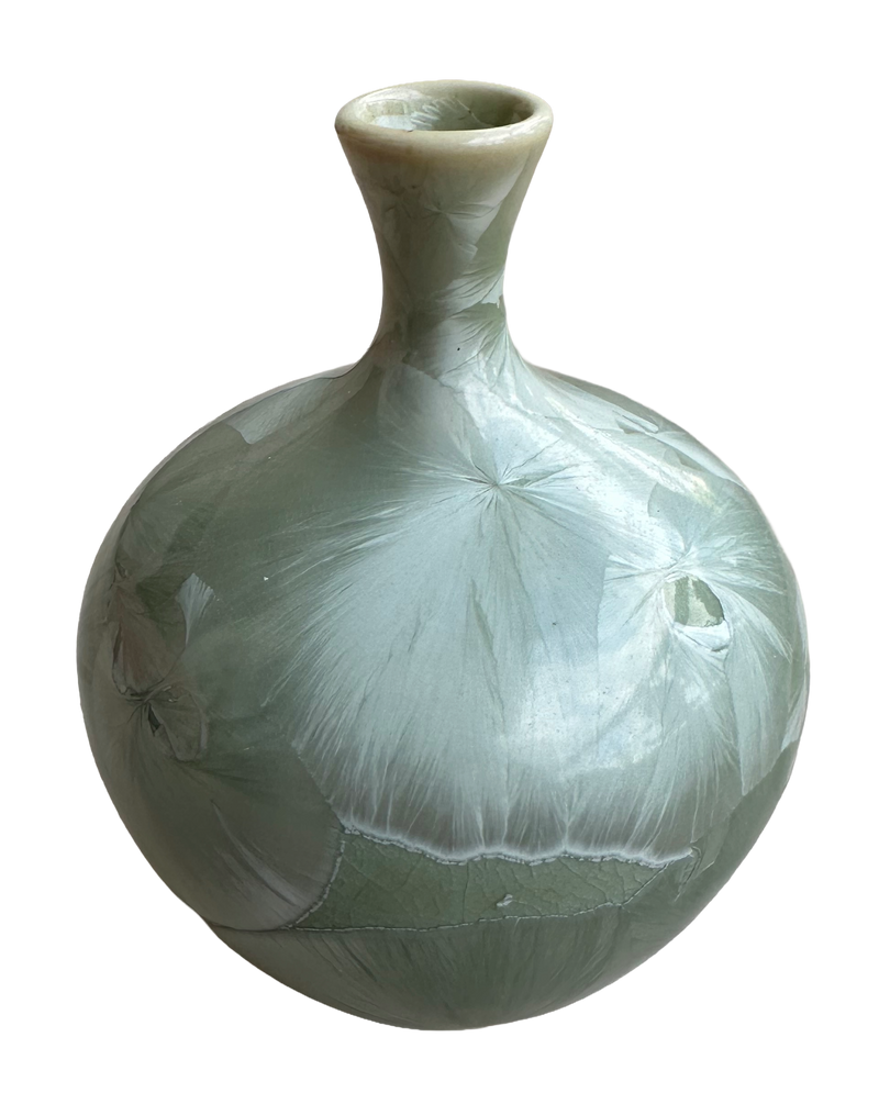 Louise Reding miniature porcelain bud vase with a rounded body, narrow neck and pale sage-green crystalline glaze.
