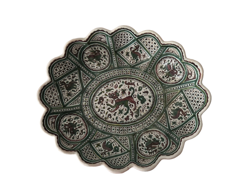 Top-down flat lay, full bowl Portuguese Coimbra faience centrepiece bowl, top view, green and white hand-painted medieval bestiary decoration, scalloped rim, c.1960–1980