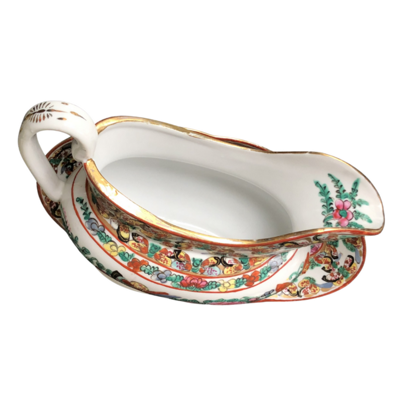 vintage Famille Rose hand-decorated porcelain sauce boat and stand.  Japanese porcelain decorated in Hong Kong with auspicious symbols including butterflies, roses and peaches in the 20th century back stamp YT.
