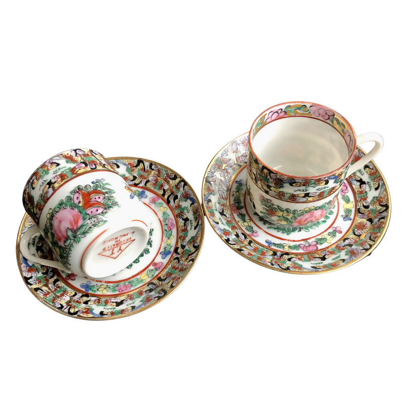 pair of fabulous vintage Famille Rose hand-decorated eggshell porcelain coffee cups and saucers. Japanese porcelain decorated in Hong Kong with auspicious symbols including butterflies, roses and peaches in the 20th century back stamp YT