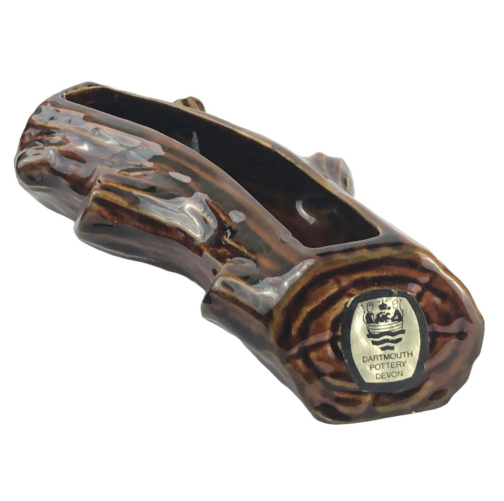 Dartmouth Pottery miniature log planter with glossy brown bark detail and original gold and black Devon foil label.
