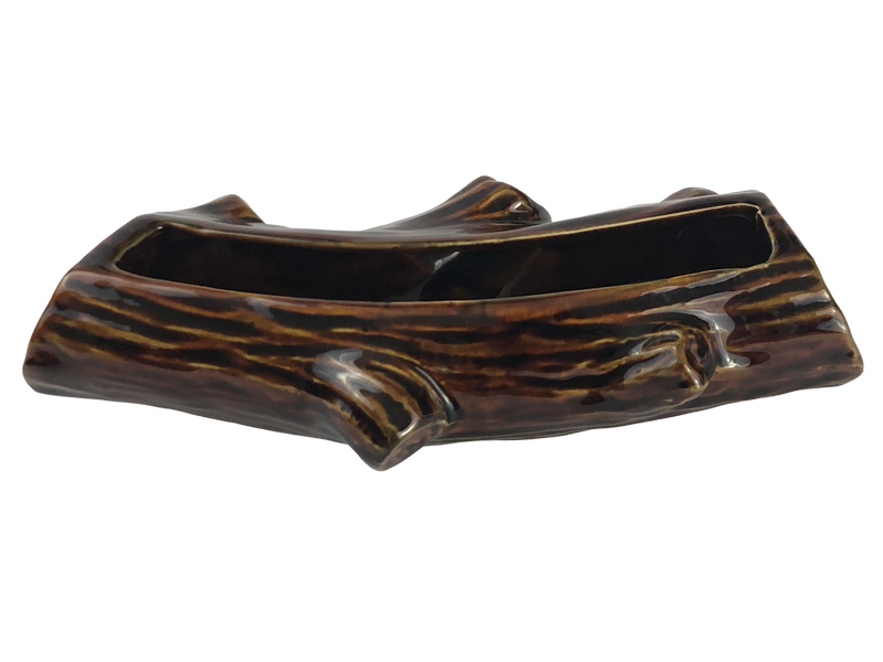 Side view of Dartmouth Pottery miniature log planter showing two projecting branch stubs and glossy brown glaze.