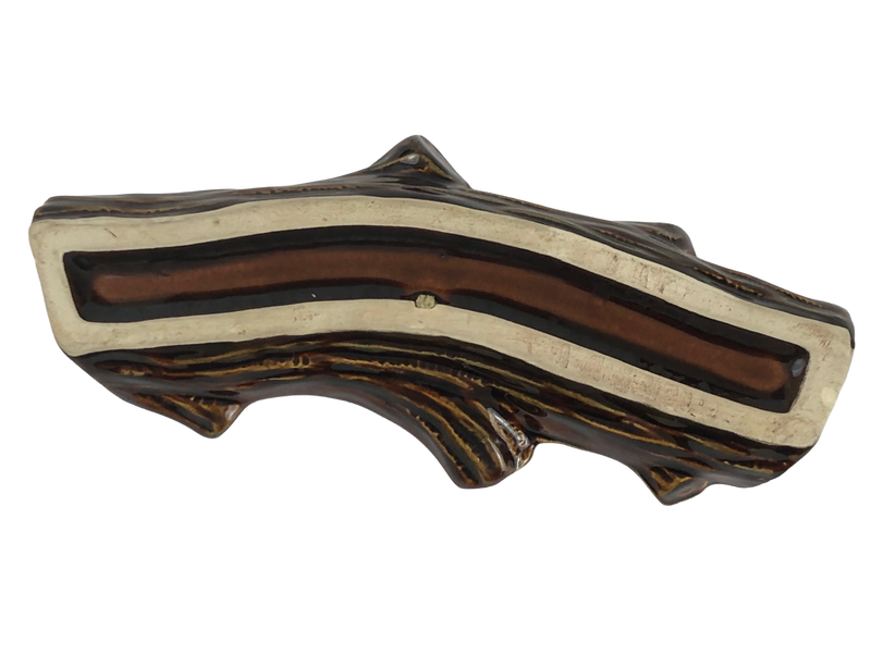 Underside of Dartmouth Pottery log planter showing the unglazed cream-coloured foot rim and recessed brown glazed base.