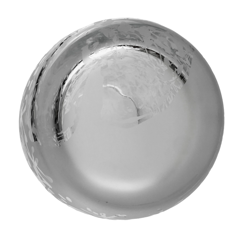 Underside of the clear crystal vase showing its circular glass base.