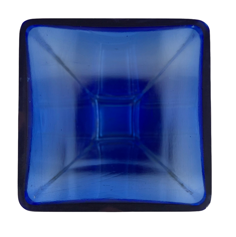 View into the square opening of a cobalt blue glass vase, showing the tapering interior.