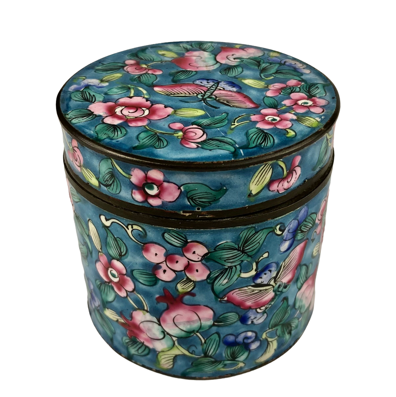 Chinese Canton enamel jar showing a painted butterfly, pink blossoms and fruit motifs beneath the matching fitted lid.