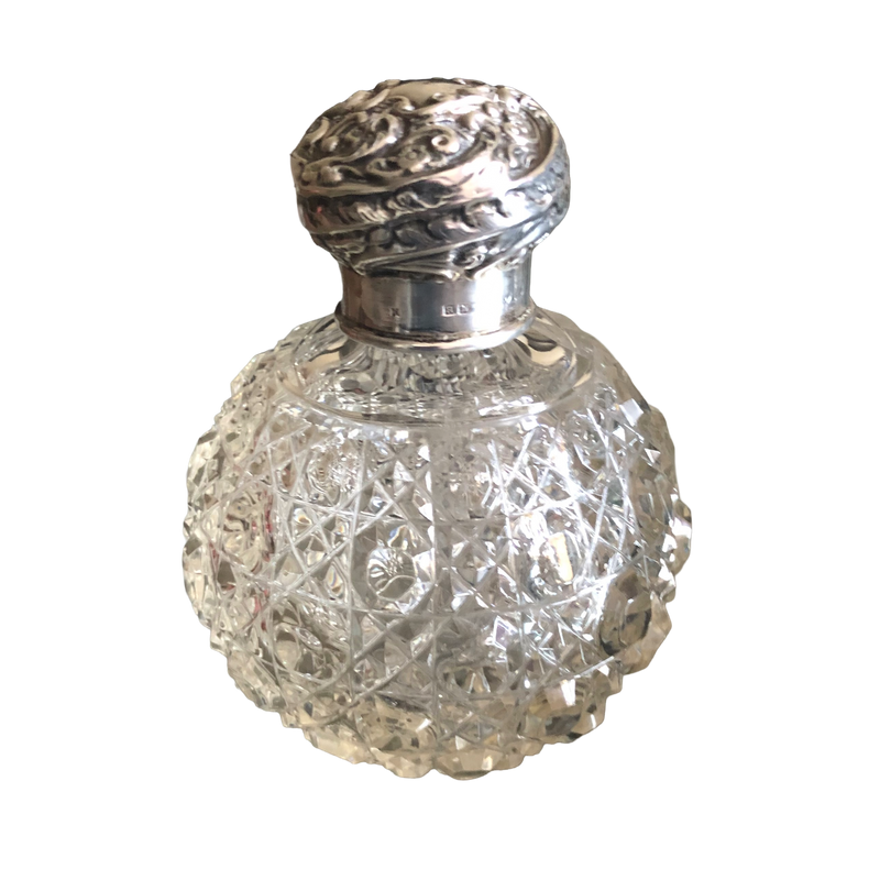Henry Matthews silver scent bottle, Chester 1896, with a rounded hobnail-cut glass body and domed floral silver cap.