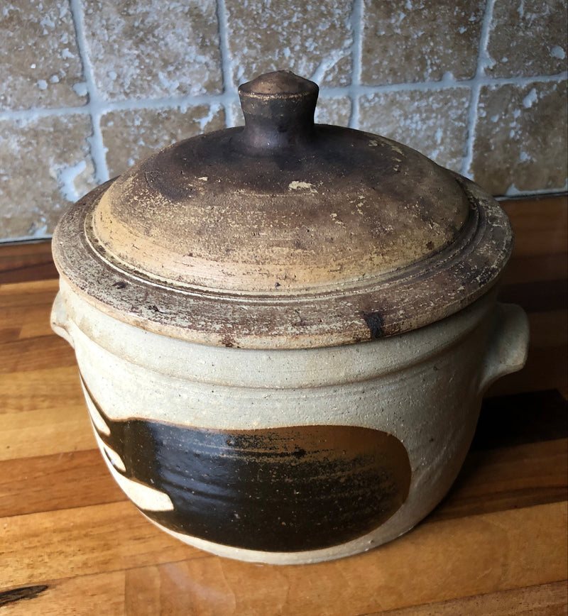 Alan Brough Newlyn Pottery stoneware casserole with domed brown lid, pale buff body and broad dark brown brushwork.