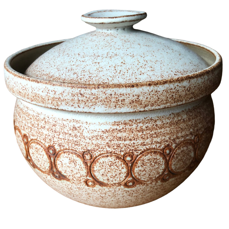 Vintage Geraldine stoneware casserole with domed lid, pale speckled glaze and impressed circular decoration.