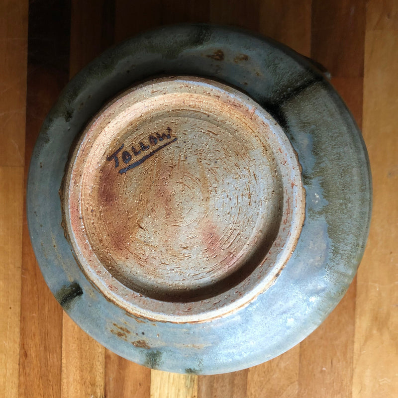 Base of Vera Tollow stoneware casserole showing the hand-painted, underlined TOLLOW signature within the foot ring.
