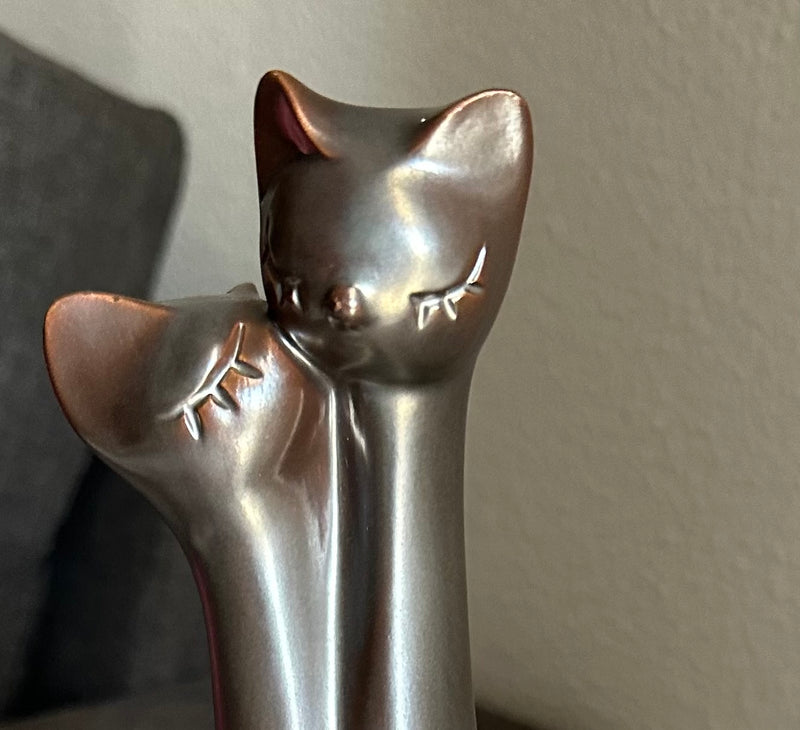 entwined cats brown