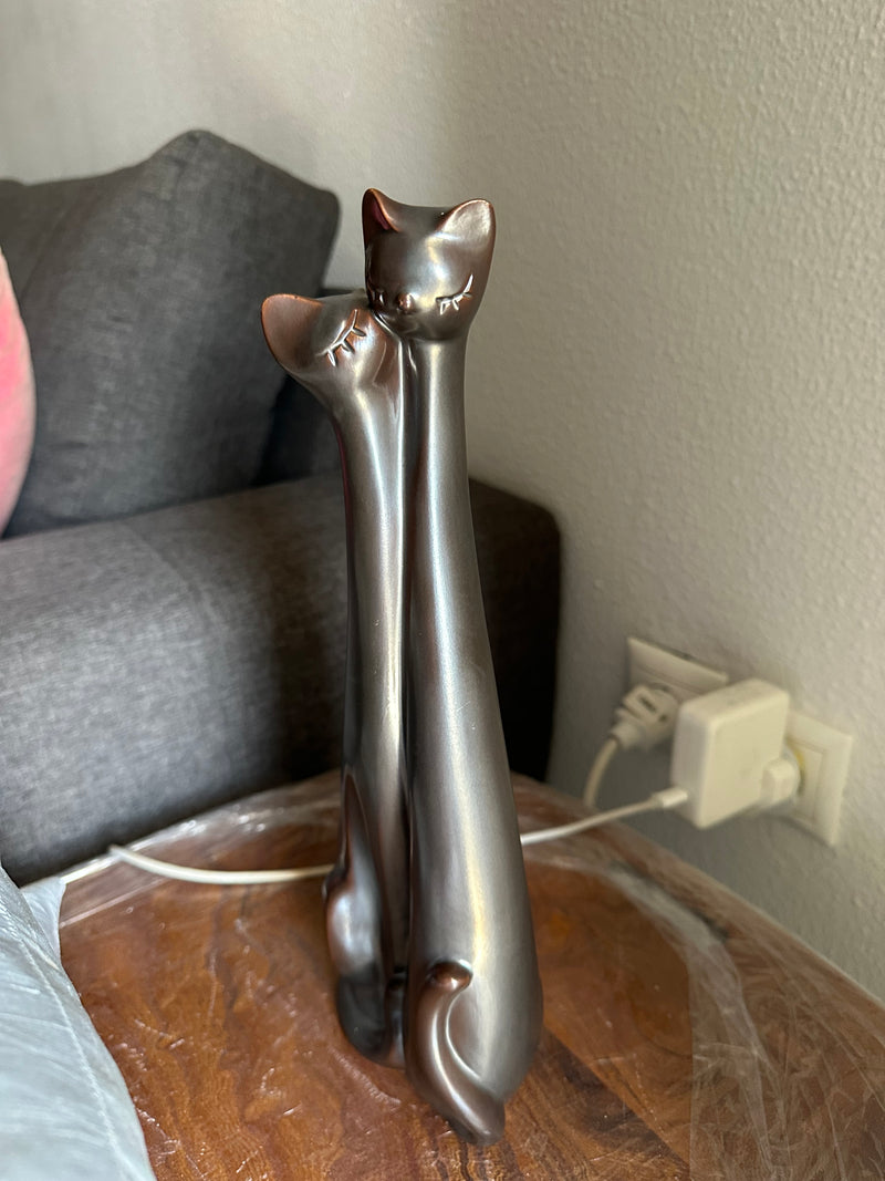 entwined cats brown