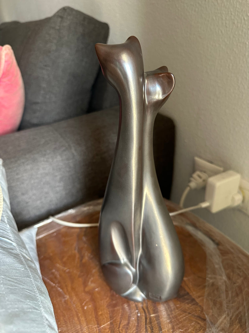 entwined cats brown
