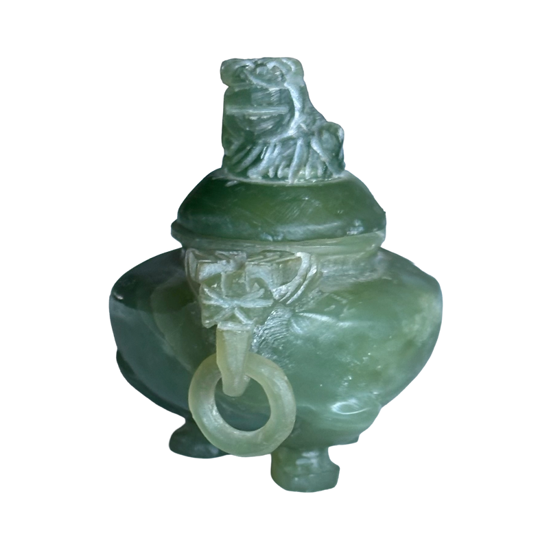 Side view of green jadeite tripod censer, highlighting the beast-head handle and freely hanging carved stone ring.