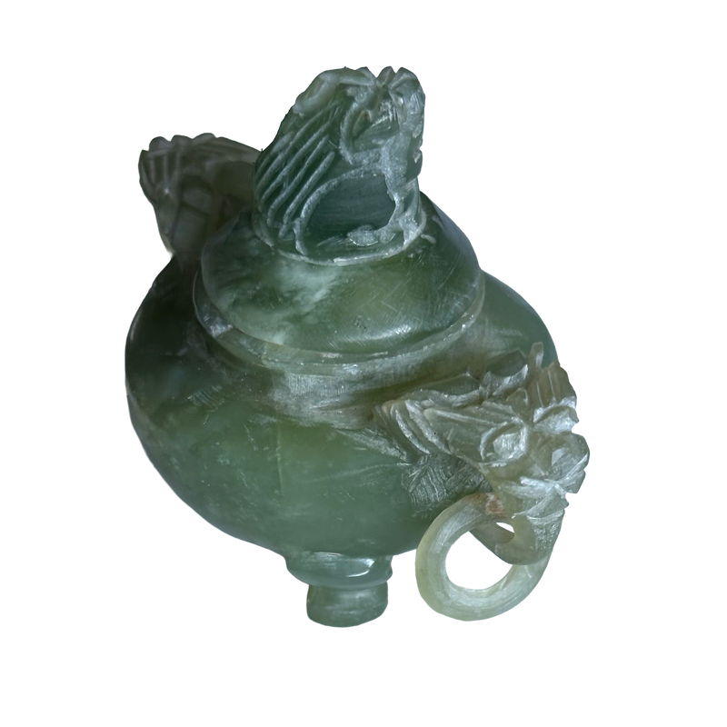 Angled view of green jadeite miniature censer, showing a carved beast-head handle, loose ring and pierced cover finial.