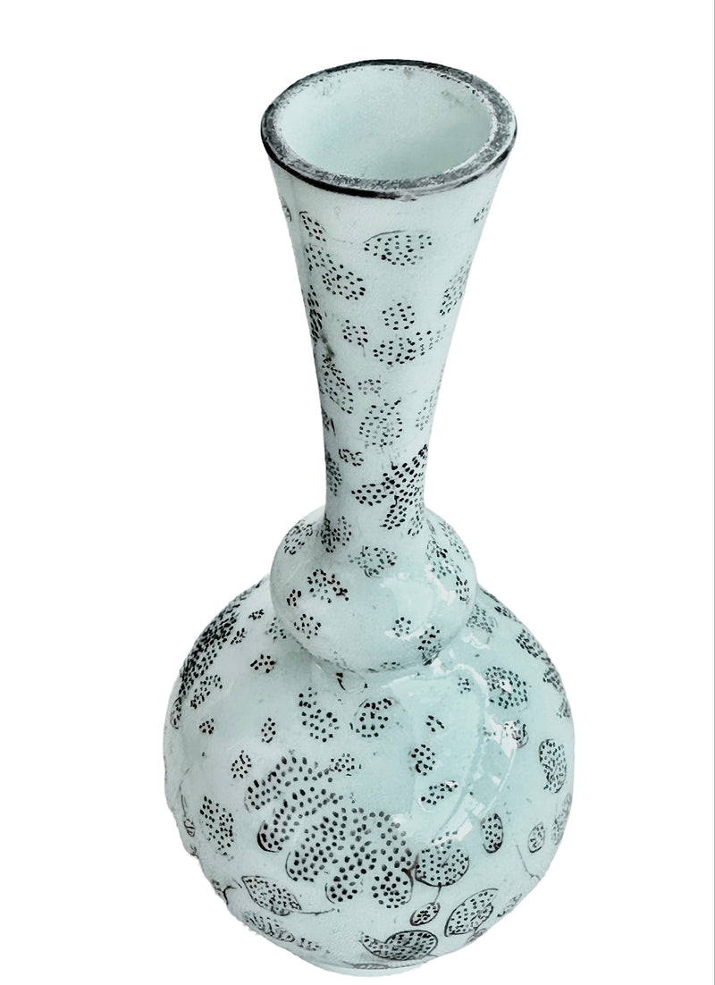 Angled view of the French opaline glass bud vase showing its flared opening, worn gilt rim and decorated neck.