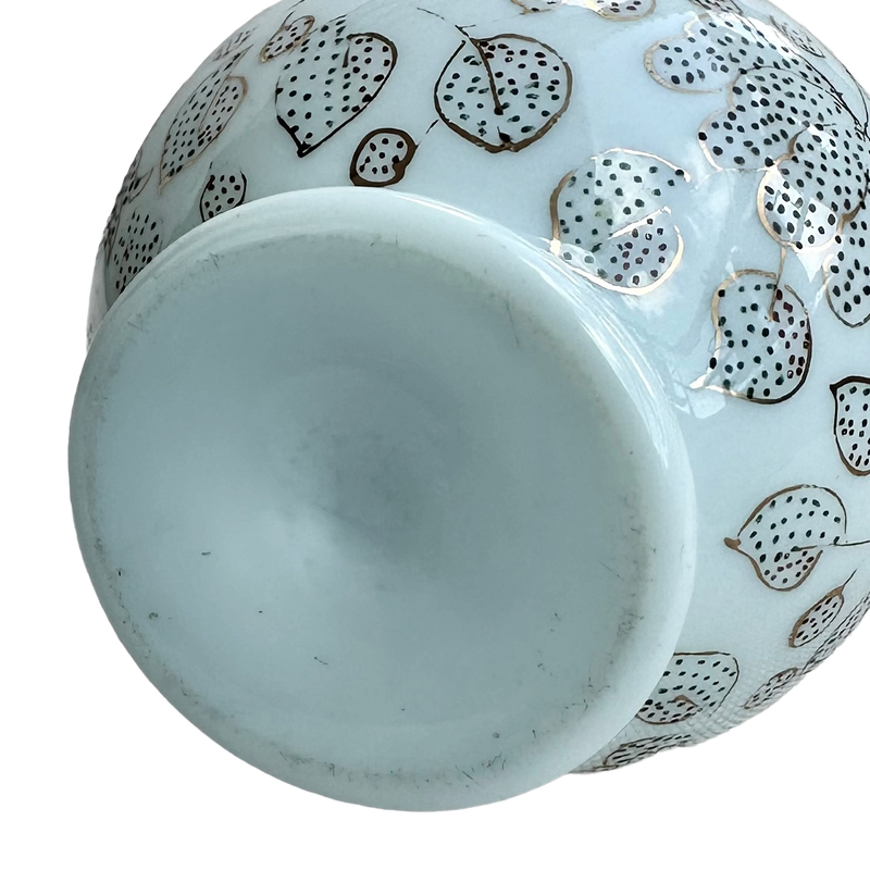Close-up of the unmarked recessed base of the celadon opaline glass vase, showing light surface wear.