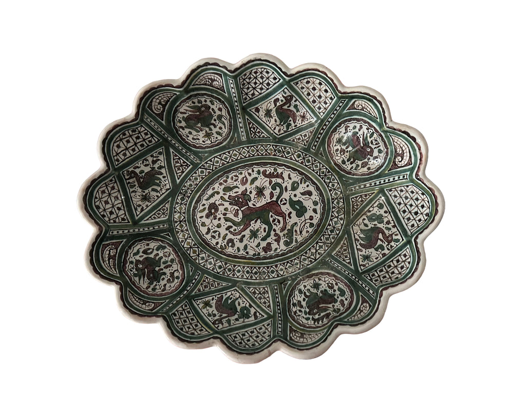 Top-down flat lay, full bowl Portuguese Coimbra faience centrepiece bowl, top view, green and white hand-painted medieval bestiary decoration, scalloped rim, c.1960–1980
