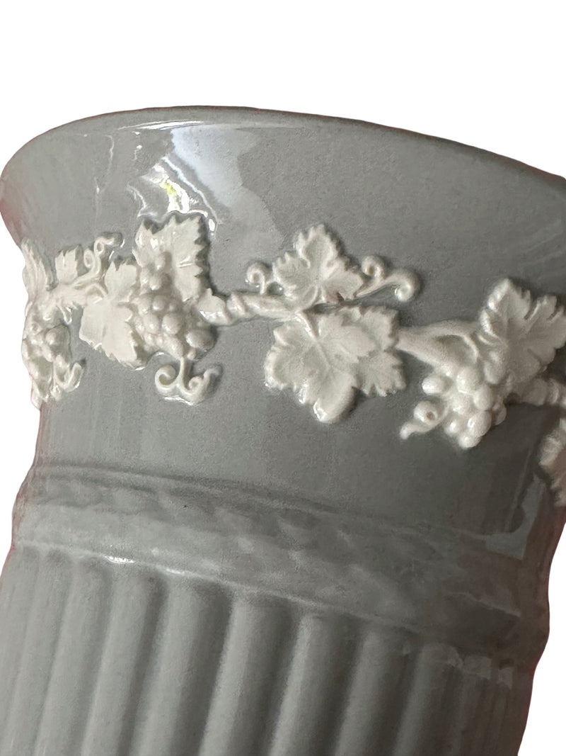  Close-up of cream embossed grapevine decoration with grapes and vine leaves on Windsor Grey Wedgwood Queen's Ware vase
