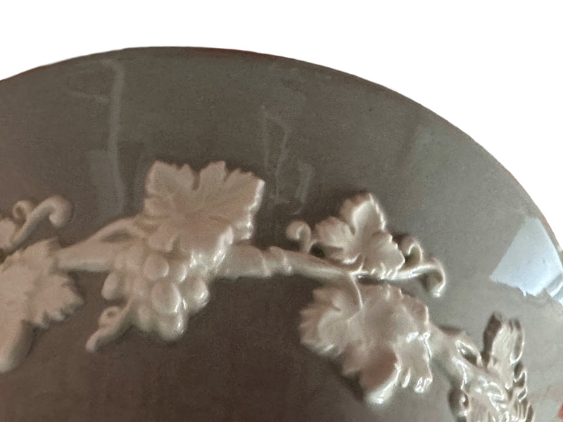Interior view of Wedgwood Queen's Ware vase showing cream embossed grapevine detail against Windsor Grey ground