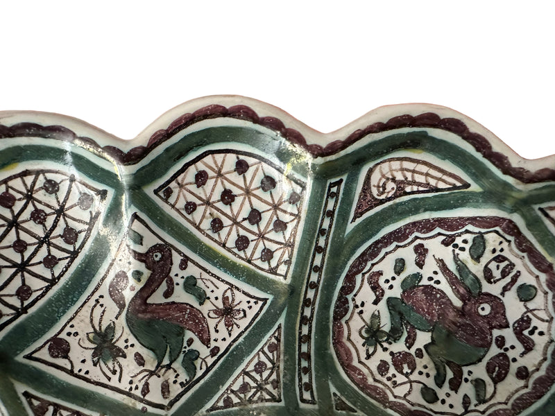 close-up detail, lower rim section (interior)s divided by green geometric latticework, manganese and green palette