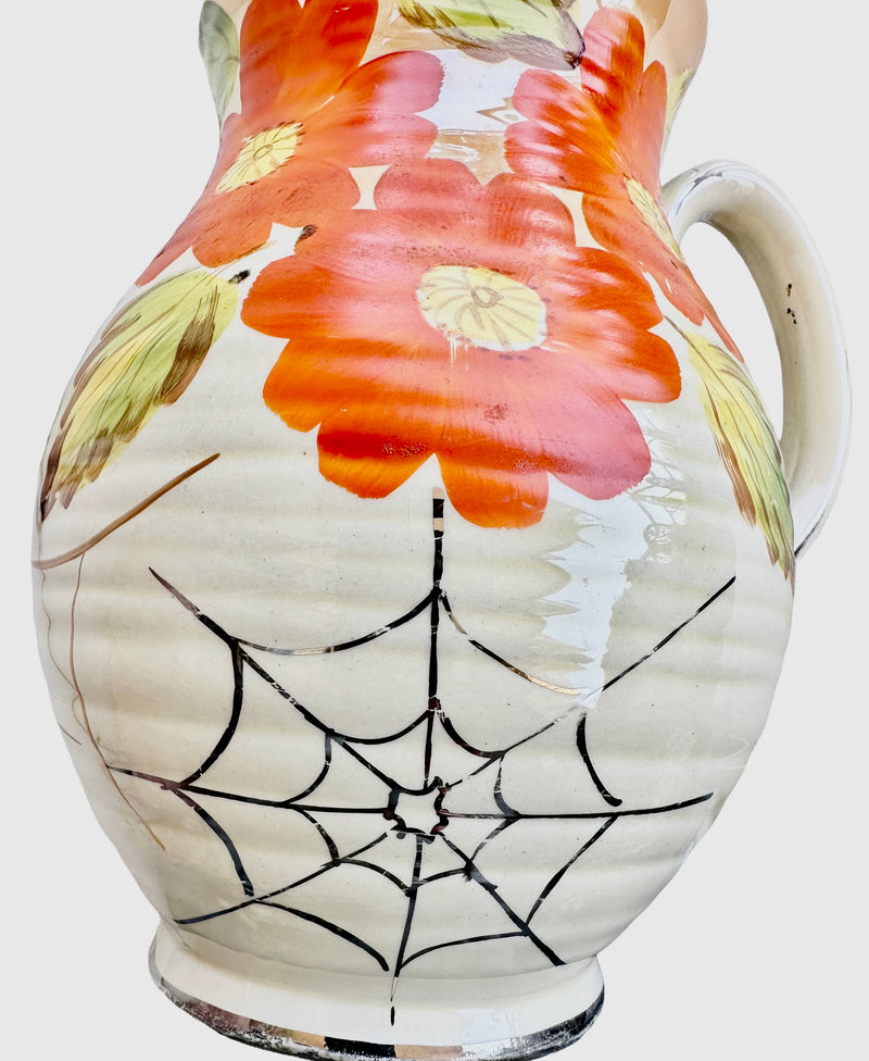  close-up of spider's web and nasturtiums Close-up of platinum-lustre spider's web decoration below orange nasturtium flowers on Arthur Wood Art Deco jug vase, Pattern 3123, c.1930s