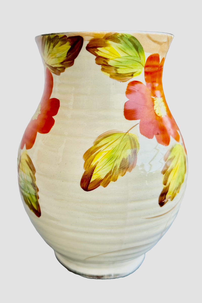  Front  View no handle visible, nasturtium leaves prominent Reverse side of Arthur Wood Art Deco jug vase showing orange nasturtium blooms and green leaves on cream ribbed body, c.1930s