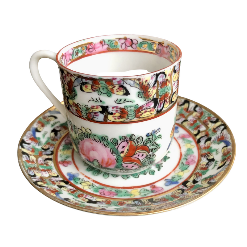 pair of fabulous vintage Famille Rose hand-decorated eggshell porcelain coffee cups and saucers. Japanese porcelain decorated in Hong Kong with auspicious symbols including butterflies, roses and peaches in the 20th century back stamp YT